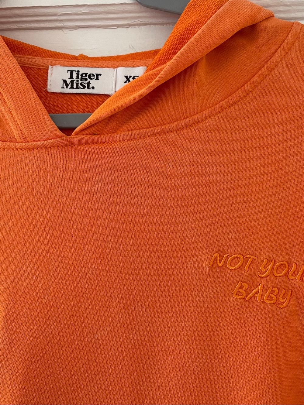 Tiger Mist Orange Hoodie - "Not Your Baby" Embroidered